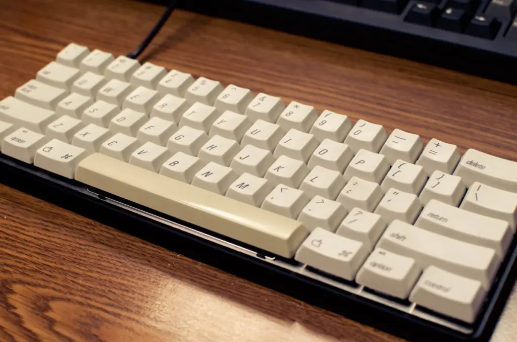 This keyboard was built using a custom-made plate and circuit board, orange Alps switches from an Apple IIGS k