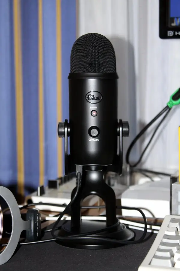 Blue Yeti Blackout condenser microphone on its desktop stand