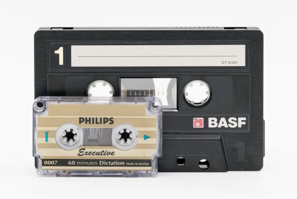 A standard audio cassette ("Compact cassette") alongside the smaller Philips " Mini-Cassette " format.
