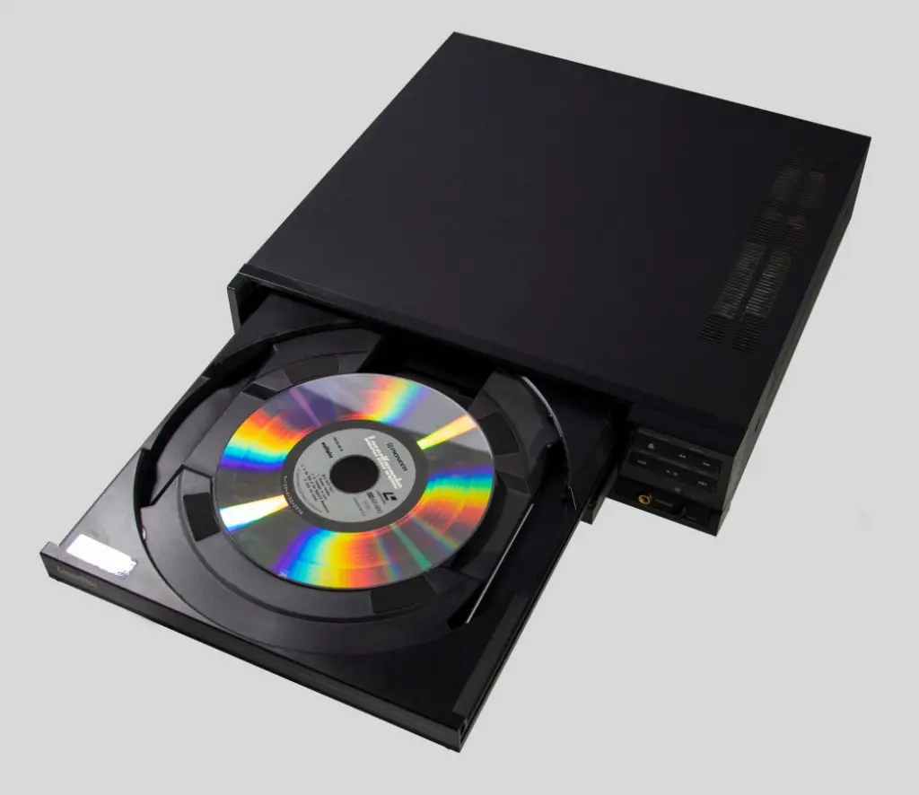 A Pioneer CLD-1030 Laserdisc player, from 1988 or 1989. Machine tray is open with a medium sized 'Karaoke' Las